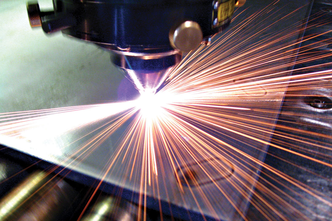 A laser cutter cutting a component for large tooling or flight hardware for the aerospace, defense, and space industry