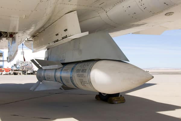 A missile on the bottom of a military aircraft