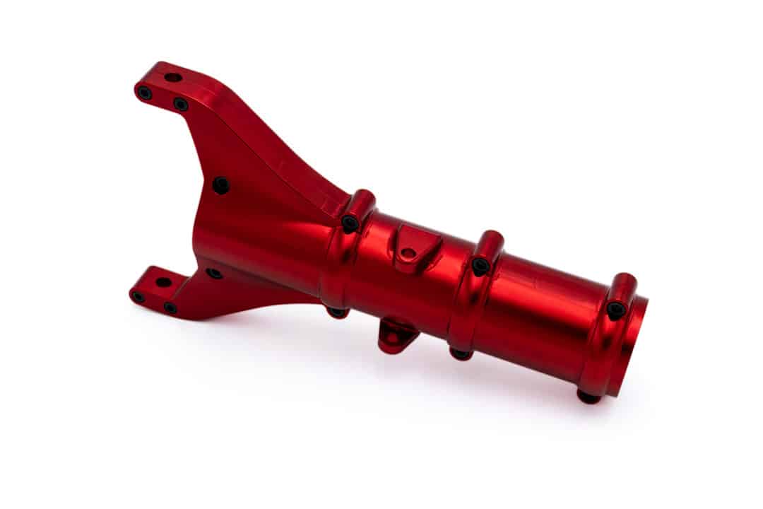 A CNC-machined aluminum landing gear assembly flight hardware with a red anodized finish