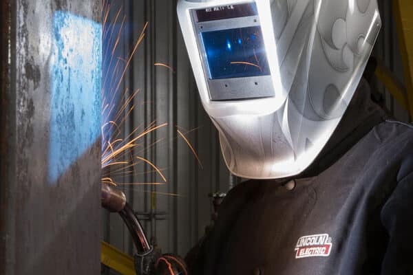 Fabricator welding a tooling component for the automotive industry