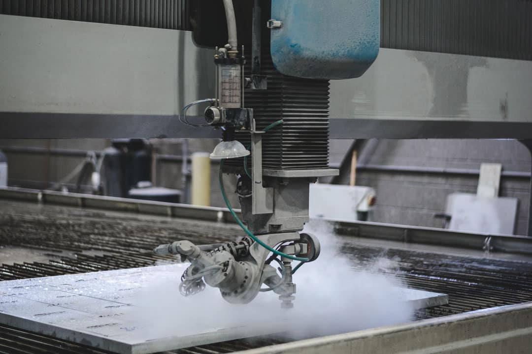A waterjet cutter cutting a component for large tooling or parts for the energy and power generation industry