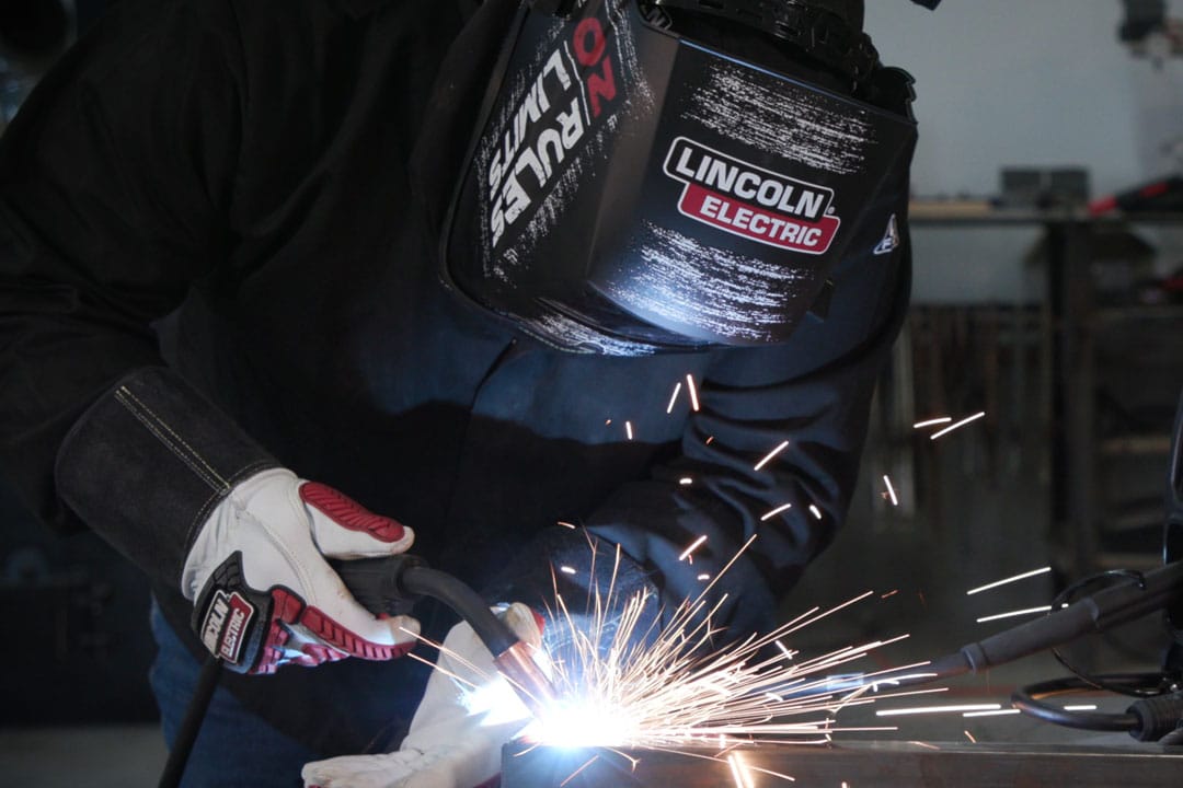 A fabricator MIG (GMAW) welding a component for large tooling or parts for the heavy equipment industry