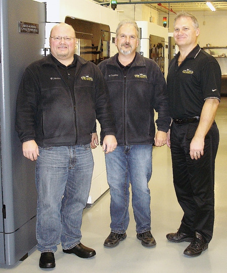 Baker Aerospace founders Scott and Kevin Baker with new Additive and Molding Tooling Director Mike Misener in the company's 3-D printing lab