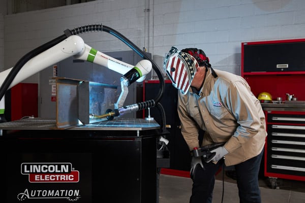 A collaborative robotic welder welding a component for the oil and gas industry