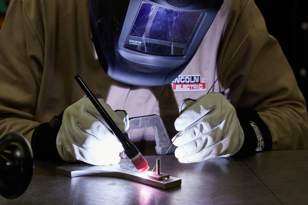 A fabricator TIG (GTAW) welding a component for large tooling or parts for the oil and gas industry