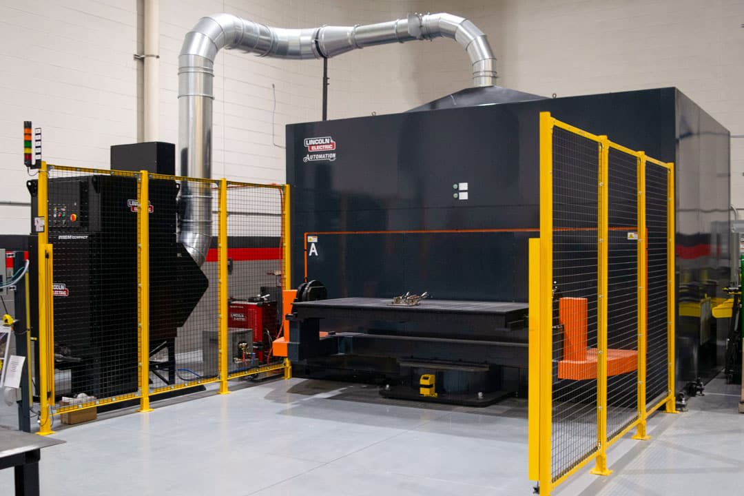 An image of Lincoln Electric's new Prototype Center in Metro Detroit, featuring a robotic welding cell for demonstrating laser welding on aluminum battery trays used in electric vehicles
