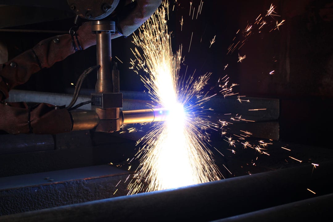 A plasma cutter cutting a component for large tooling or parts for the rail and ground transportation industry