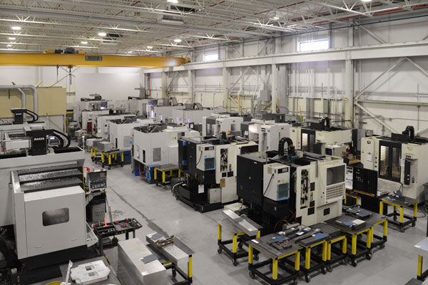 Overhead shot of small and medium three- and five-axis CNC machines at Baker Industries