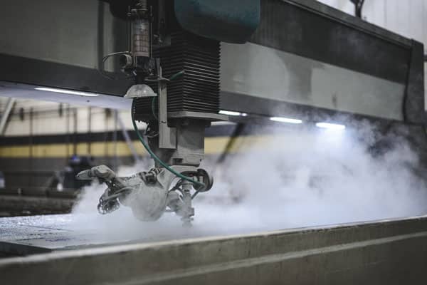 A large five-axis Flow waterjet cutting machine at Baker Industries