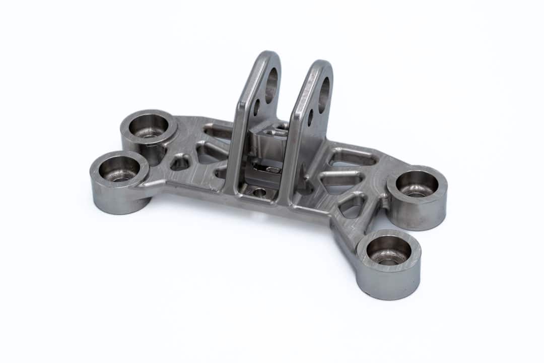 A CNC-machined stainless steel engine bracket for aircraft